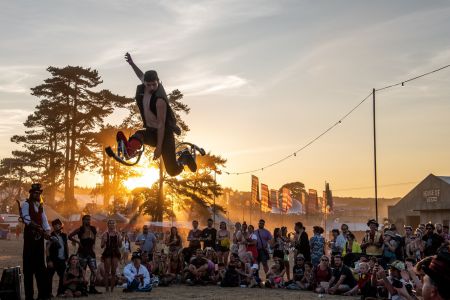 jumping stilt performer