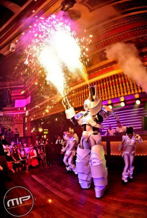 Robot And Dancers In Club