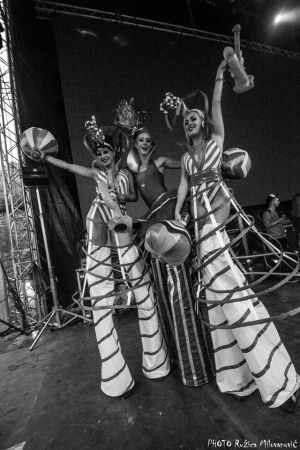 Stiltwalkers On Stage