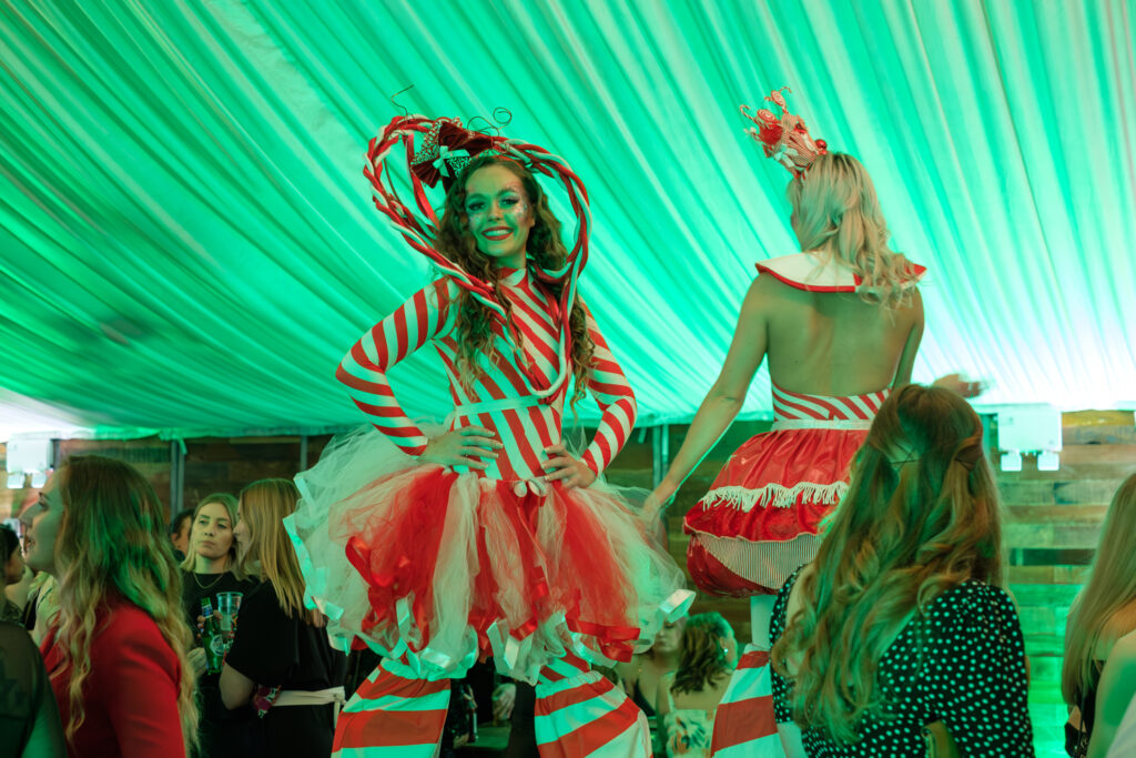 Area51's candy cane themed stilt walkers at the Heart of England Conference & Events centre for Krispy Kreme Doughnuts.