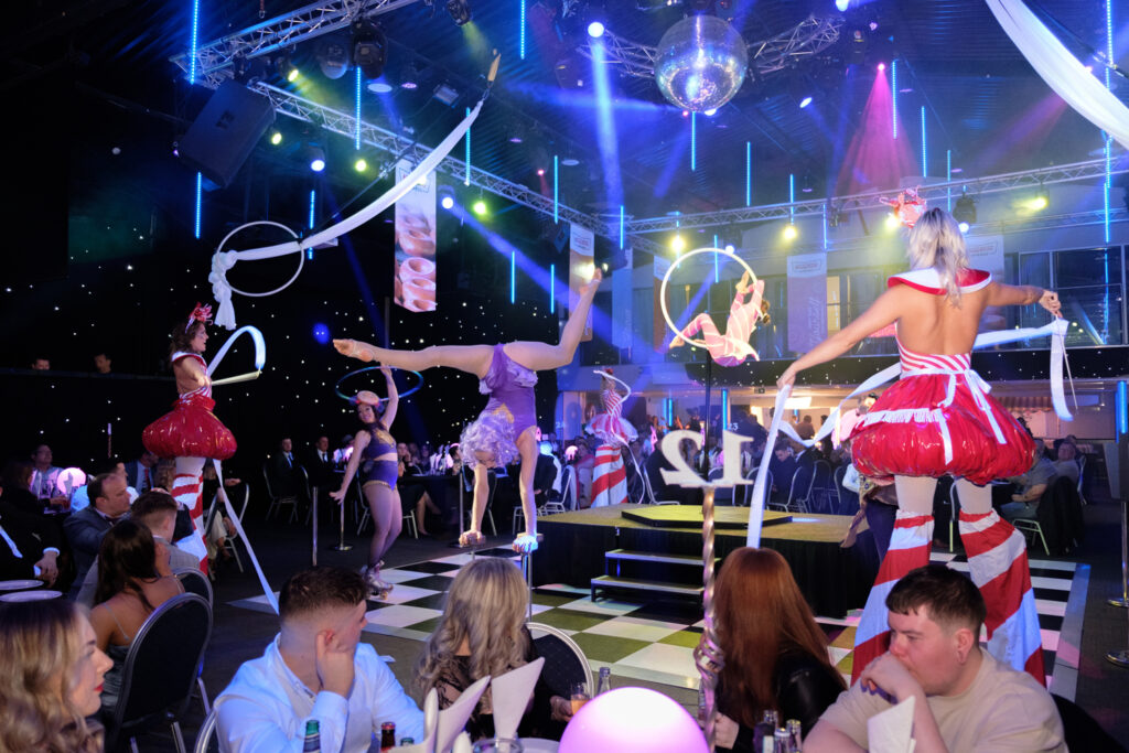 Area51's candy themed hand balance, aerial hoop and candy cane stilt walkers at the Heart of England Conference & Events centre for Krispy Kreme Doughnuts.