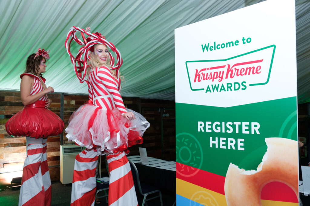Area51's candy cane themed stilt walkers at the Heart of England Conference & Events centre for Krispy Kreme Doughnuts.