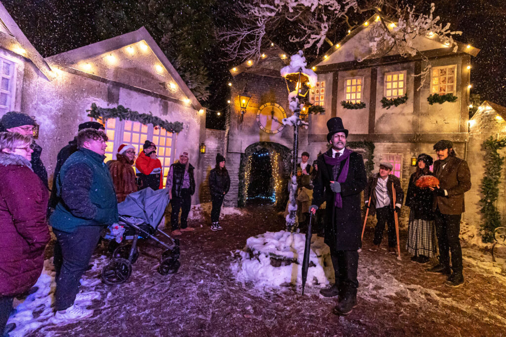 Scrooge narrating a village setpiece for a Christmas Carol inspired walkthrough